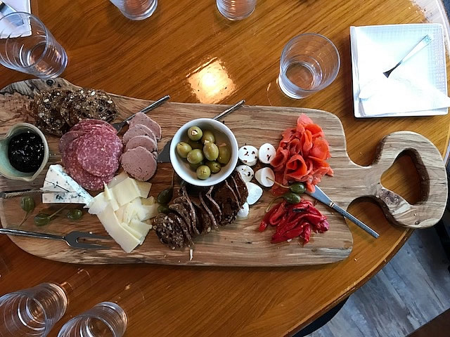 Appetizers set out on a locally crafted maple platter