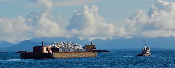 Tug and Barge from Heiltsuk Horizon loaded with marine debris